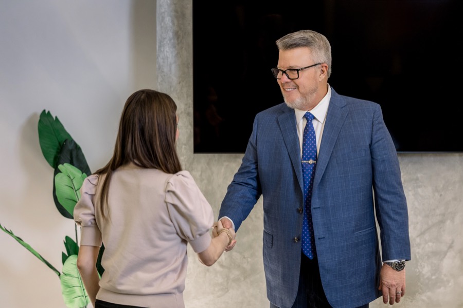 Joseph Graves welcoming a client