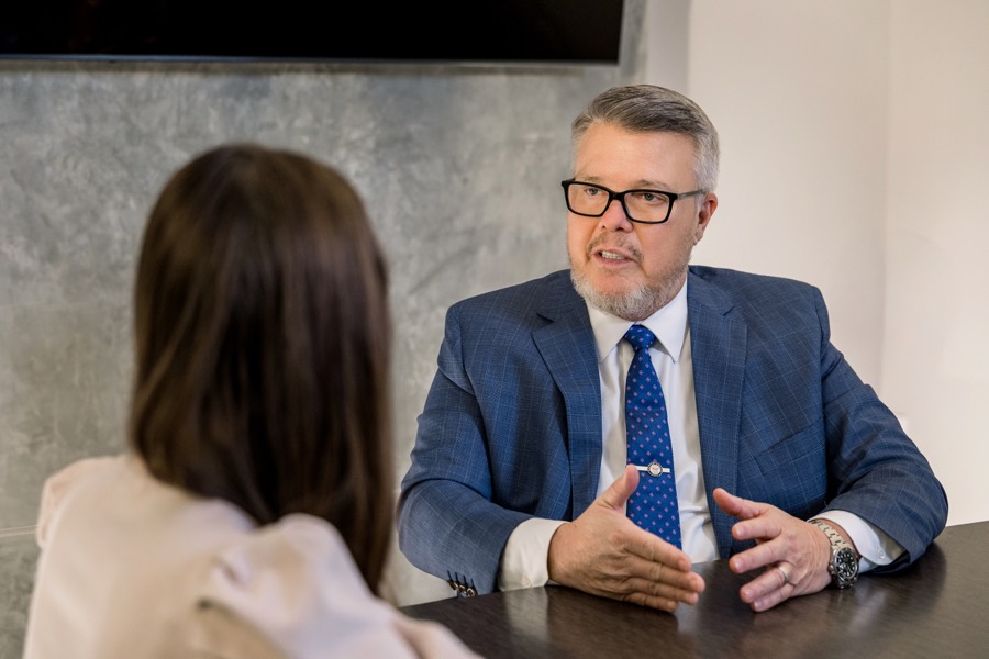 Joseph Graves listening to a client during a case review